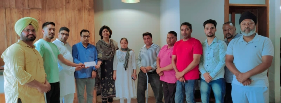 Disabled Persons Welfare Society presents a cheque of Rs 10,000 to Hair and Speech Centre for testing hearing impaired children